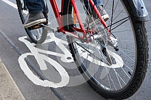 Close Up Of Man Riding Bike In Cycle Lane