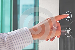 Close-up Of A Man`s Finger Pressing On Open Elevator Button