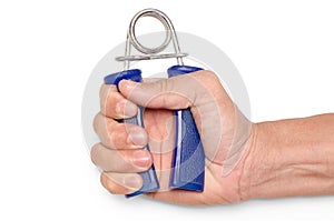 close up a man's fist with a spring grip exercise on white backg