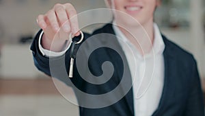 Close up of man's hand handing a car key