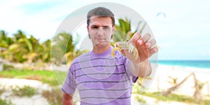 Close up of man's hand holding crab