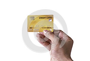 Close-up of Man`s hand holding yellow gold plastic credit card isolated on white background