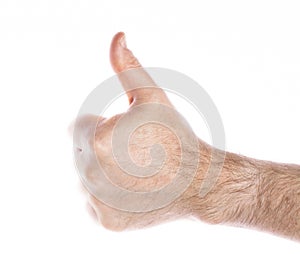 close-up of a man& x27;s hand with a raised thumb up on a white background, the concept of positive decision making, victory