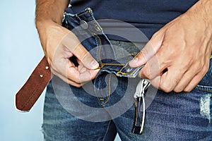 Close up shot of man in jeans with open zipper photo