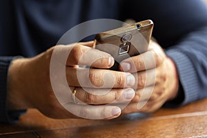 Close up of man`s hands holding and using mobile phone. Man holding a smartphone.