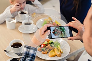 Close-up Man`s hands Taking Picture Of Food With Mobile smart Phone