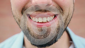 Close-up of a Man`s Mouth Smiling
