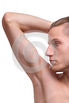 Close-up of a man showing an armpit on a white background.