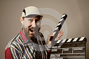 Close-up of a man smiling clapperboard cinema