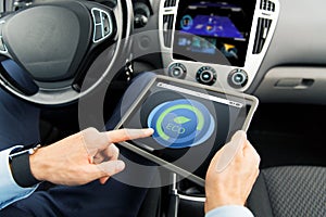 Close up of man with tablet pc in car