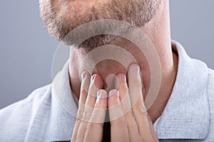 Man Having Sore Throat photo