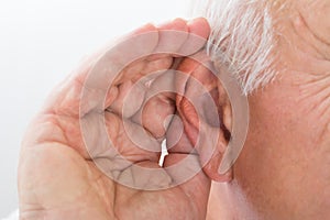 Close-up Of A Man Trying To Hear