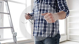 Close up of man untangling wires