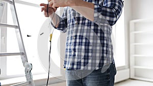 Close up of man untangling wires