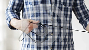 Close up of man untangling wires