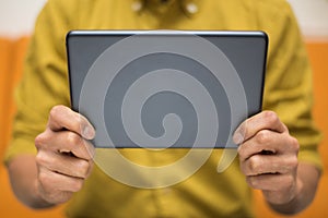 Close-up of a man using a digital tablet