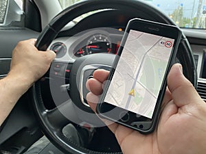 Close-up Of Man Using Gps Navigation System In Car