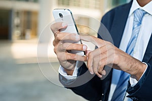 Close up of a man using his smartphone