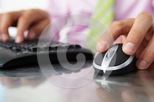Close up man using keyboard and mouse