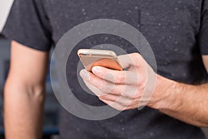 Close up of a man using mobile smart phone