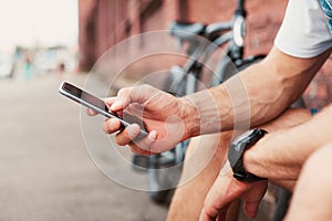 Close up of a man using mobile smart phone.