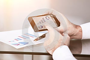 Close up of a man using mobile smart phone