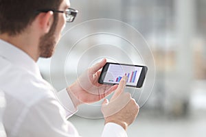 Close up of a man using mobile smart phone