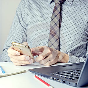 Close up of a man using mobile smart phone