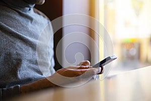 Close up of a man using mobile smart phone