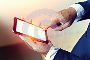 Close up of a man using mobile smart phone