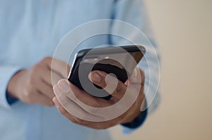 Close up of a man using mobile smart phone