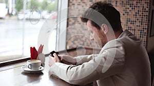 Close up of a man using mobile smart phone