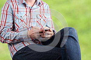 Close up of a man using mobile smart phone