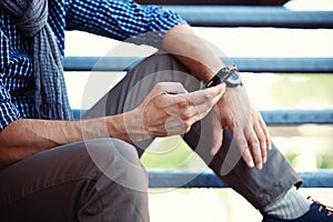 Close up of man using mobile smart phone