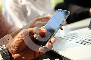 Close up of man using mobile smart phone