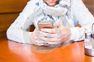 Close up of a man using mobile smart phone