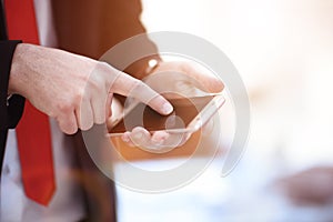 Close up of a man using mobile smart phone