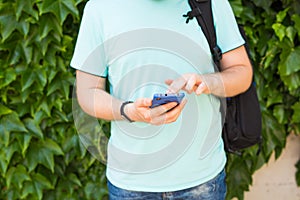 Close up of a man using mobile smart phone