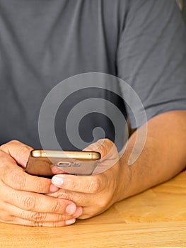 Close up of a man using mobile smart phone.