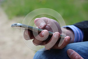 Close up of a man using mobile smart phone. Communication business concept