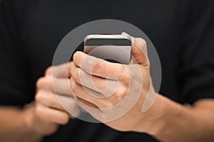 Close up of a man using a mobile smartphone