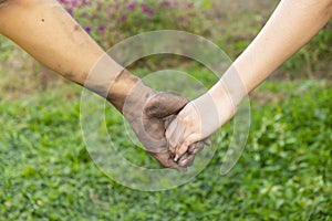 Close up man and woman hands touching holding together on blurred background for love valentine day concept, shake hand with a d