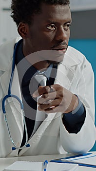 Close up of man working as medical specialist with tablet