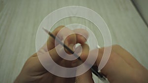 Close up of a manicurist filing woman`s nails in the salon.