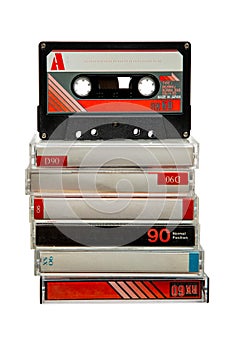 Close-up of many audio tapes. Analog storage medium. Cassettes for audio recordings and music. Isolate on a white back