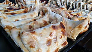 Close up of many beef filled empanada or empanada de Pino, delicious Chilean baked pasty