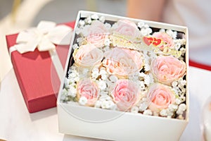 Close up many pink rose in the red gift box with ribbon for flower background or texture - Happy valentine`s day concept