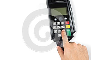 Close up manâ€™s hand pressing pin code or number on credit card