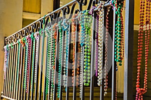 Close-up of Mardi Gras Beads Hanging from a Balcony