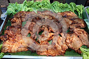 Close up, marinated pork neck, grilled herbs With green lettuce Thai style grill food